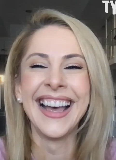 Ana Kasparian laughing with her head back 