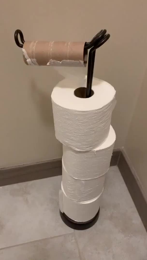 Clever one handed toilet paper reload mechanism