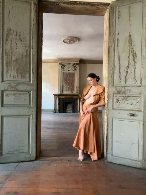 Playing in a Victorian dress in an abandoned Victorian home