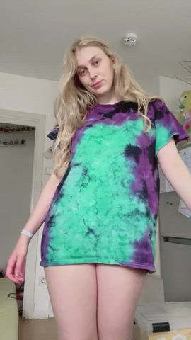 Taking off colorful t-shirt