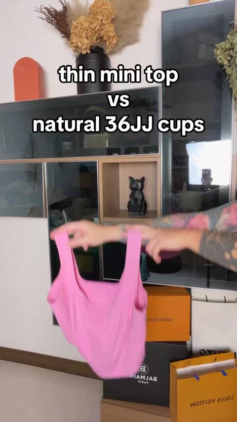 36JJ cups bouncing in a pink sports bra