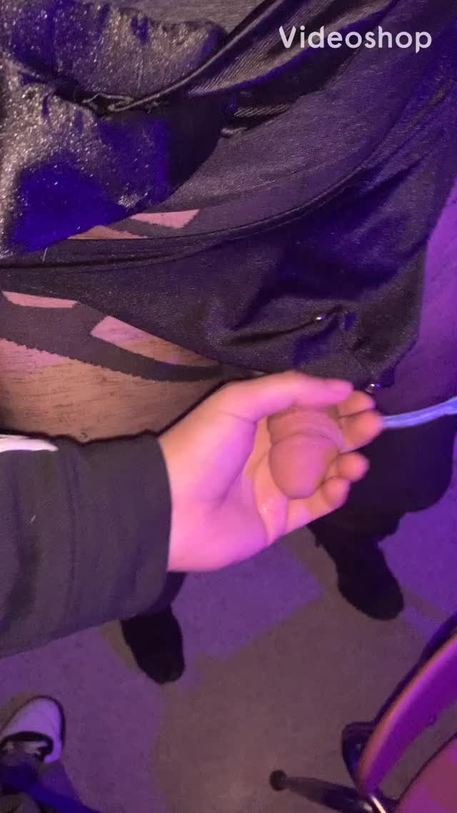 Servicing a sissy at an adult arcade