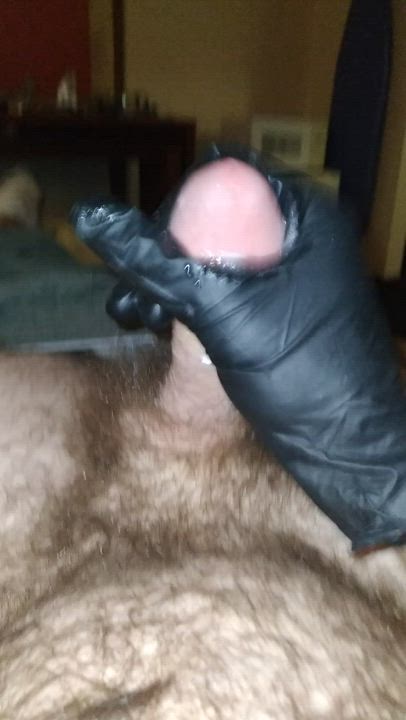 Cumming slowly with a black glove on