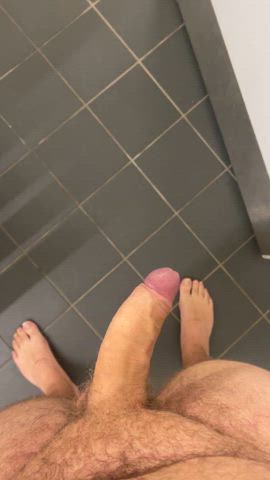 Naked in public restroom and shower area.