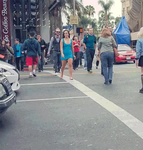 Happy girl does an embarrassing cartwheel on a busy street [gif]