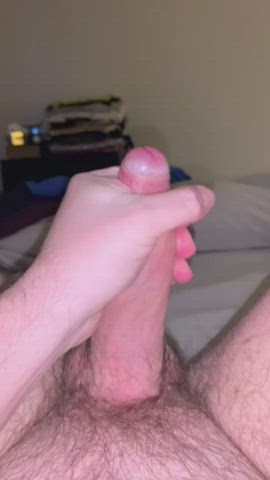 Massaging the cum out of a thick uncut dick
