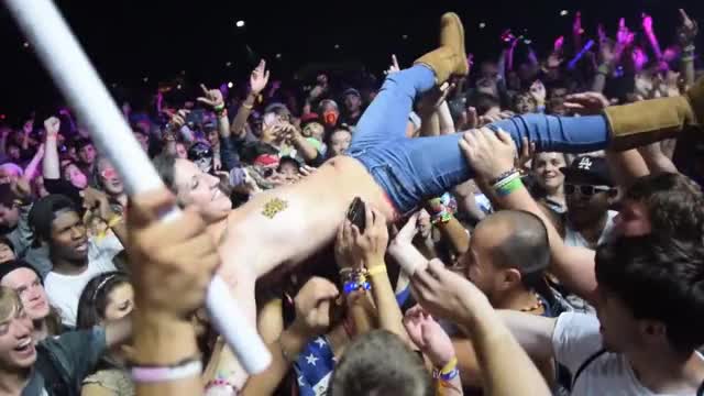 Topless Crowd Surfing at a Festival