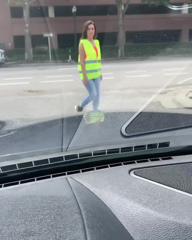 Construction girl pulls jeans down