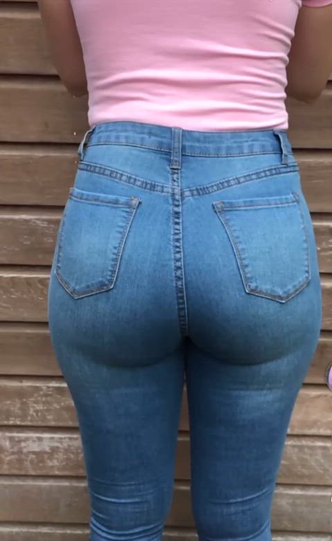 Shaking her tight jeans ass 