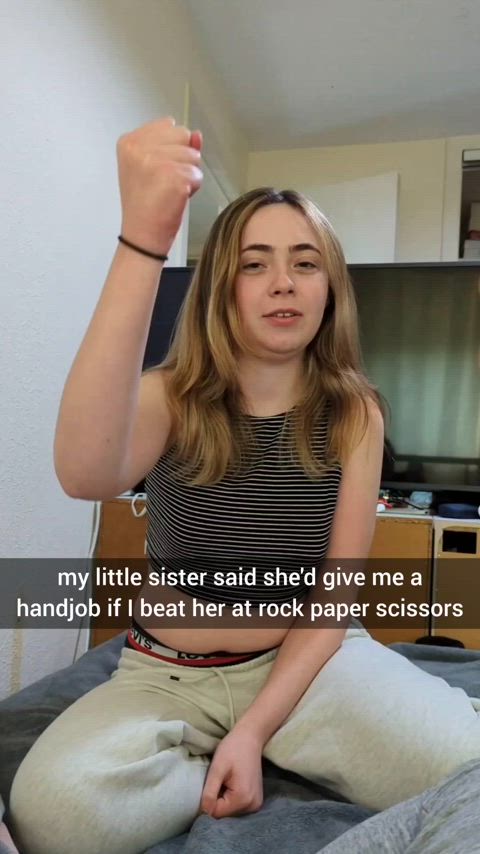 Little sister lost at rock, paper, scissors