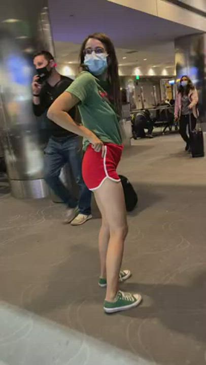 Flashing her buttplug at the airport
