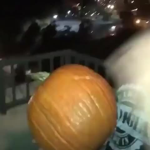 Guys throw a pumpkin off balcony, hit power line