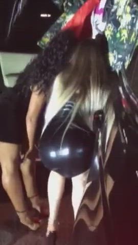 two girls sucking some guys dick outside the club