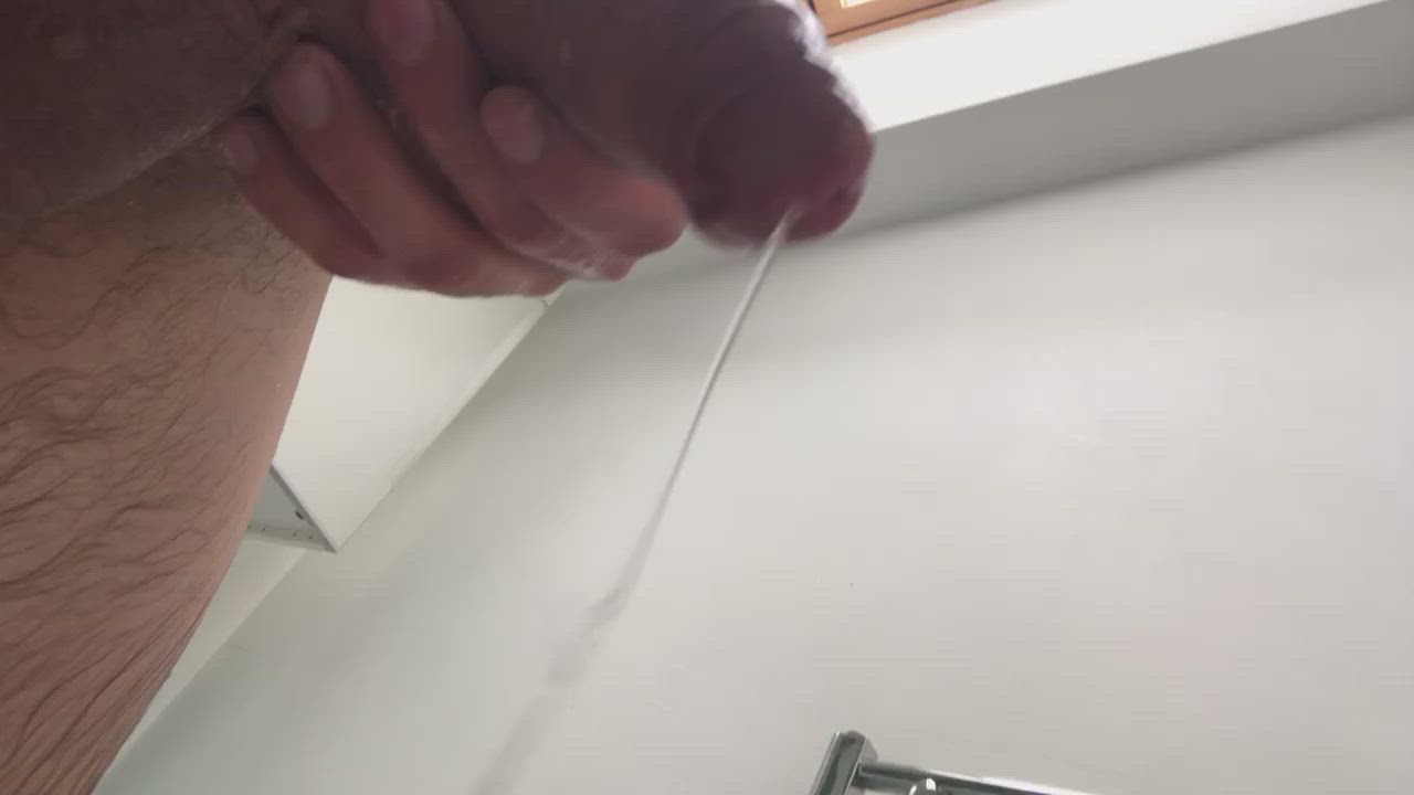 Precum dripping to the floor after a week without cumming.