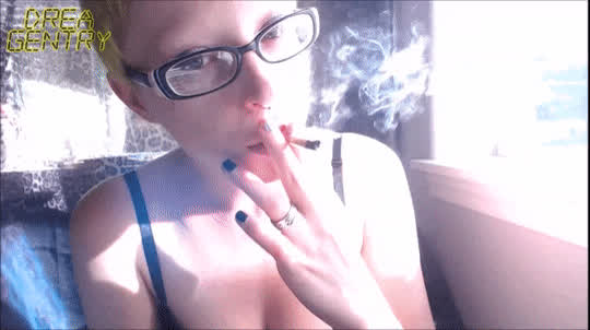 blue eyes cleavage glasses goth lips short hair smile smoking clip