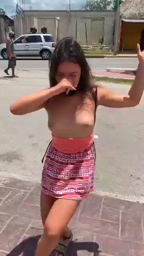 Dancing topless in the street