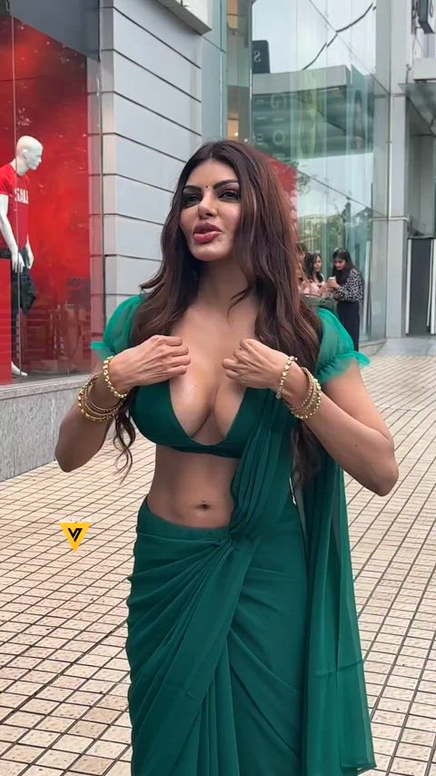 Sherlyn Chopra in dark green saree