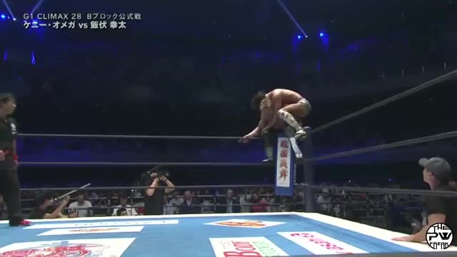 Kota Ibushi Double foot stomps through Kenny Omega's head from the top turnbuckle