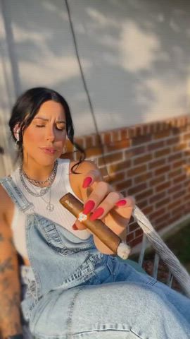 Reina Smoking a cigar