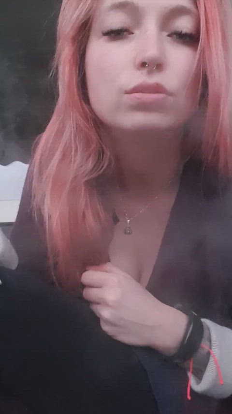 Theresa Smoke with red hairs smokes a cigarette 