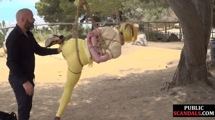 Latina suspended in rope bondage and disgraced like a pig in the park
