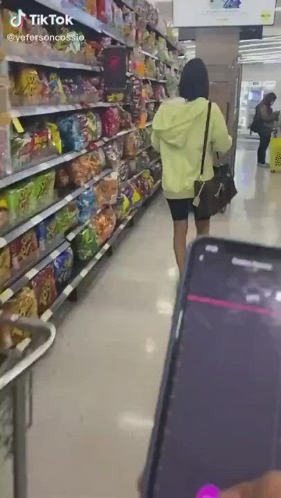Controlling her vibrator at a shop