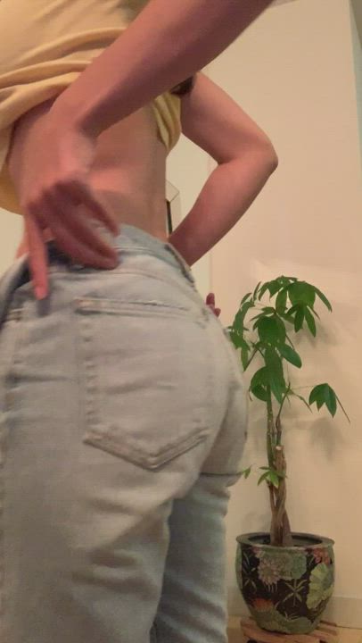 squeezing her ass into jeans