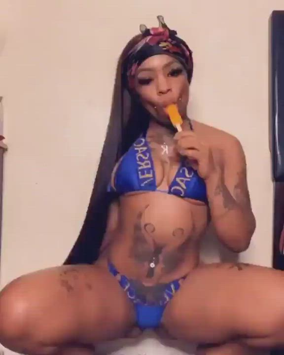 Tatted up ebony babe who loves popsicles