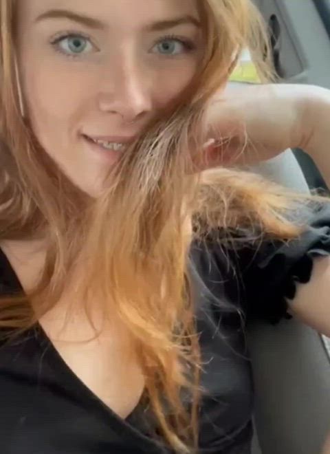 Sexy redhead shows her tits