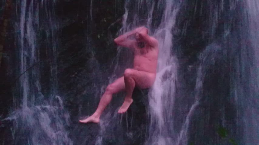 Nude night in the waterfall