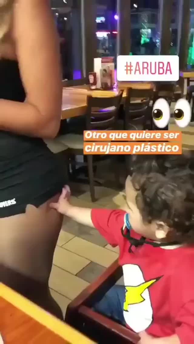 Cute baby playing with hooters waitress!