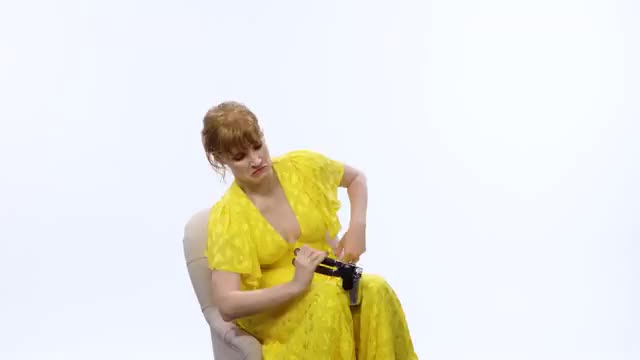 Jessica Chastain puts a big black object in her mouth