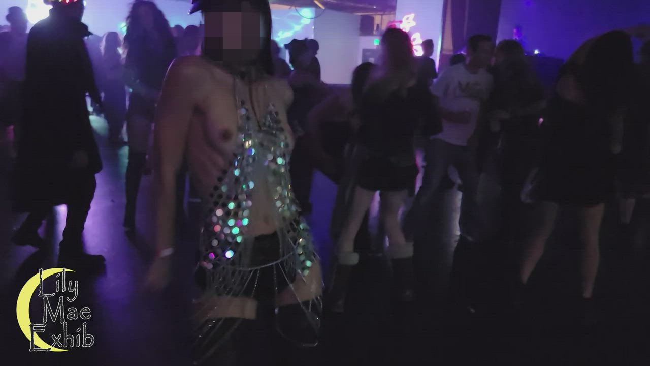 Tits slipped out while dancing in a crowded nightclub
