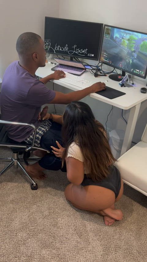 Stroking his big black cock while he plays his games