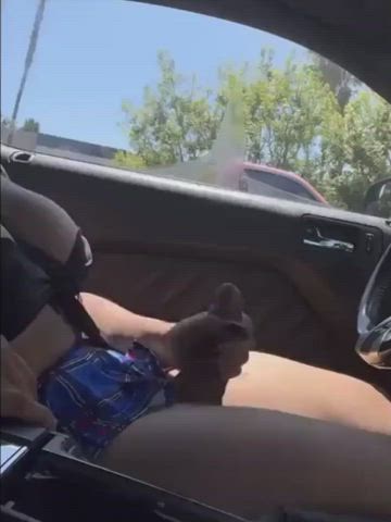 Black top blue plaid skirt in a car