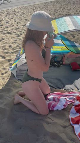 A redhead and a blonde go to the beach