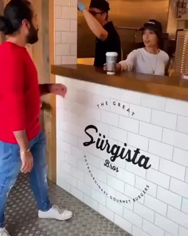 The barista is watching the whole time