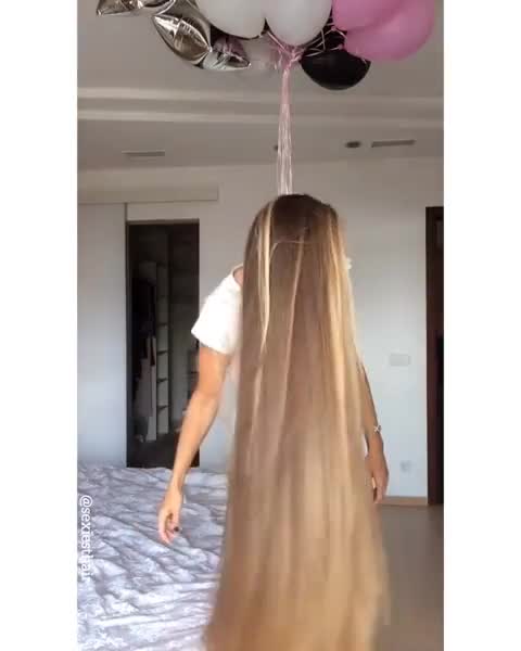 Blonde loves playing with her long hair