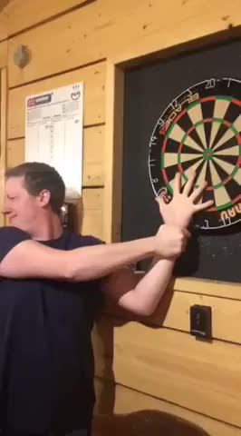 darts prank goes wrong and gets stuck in lads hand