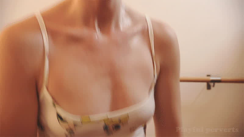 Close up on Mia sweating chest in leotard during cardio workout