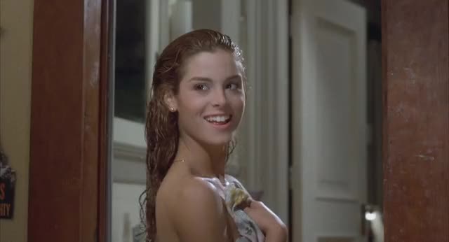 Betsy Russell with a well-placed towel