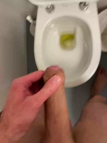 Enjoying a morning glory piss, stroking my uncut cock