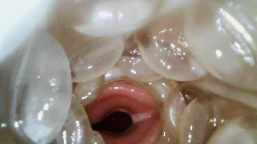Closeup cumshot view from the inside of an already creampied Fleshlight Quickshot