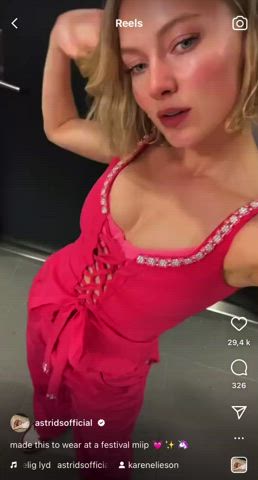 Astrid S showing off her cleavage in a pink bra