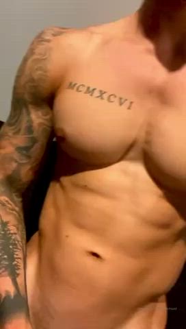 Guy with perfect abs and cock jerking off