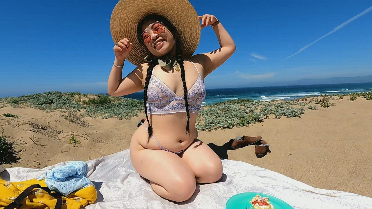 I tried to be sexy for our beach picnic until I noticed a spider in the sand
