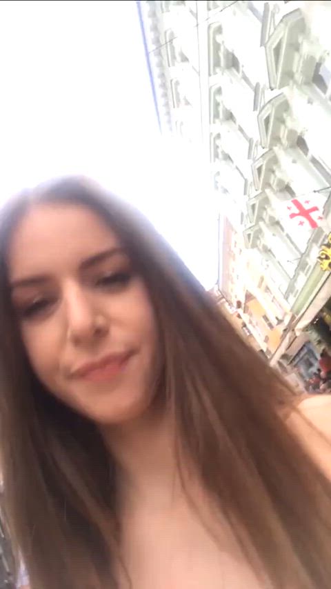 Stella Cox walking down a busy street