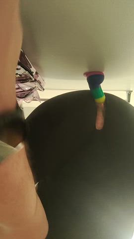 Riding a dildo stuck to the wall through my leggings 