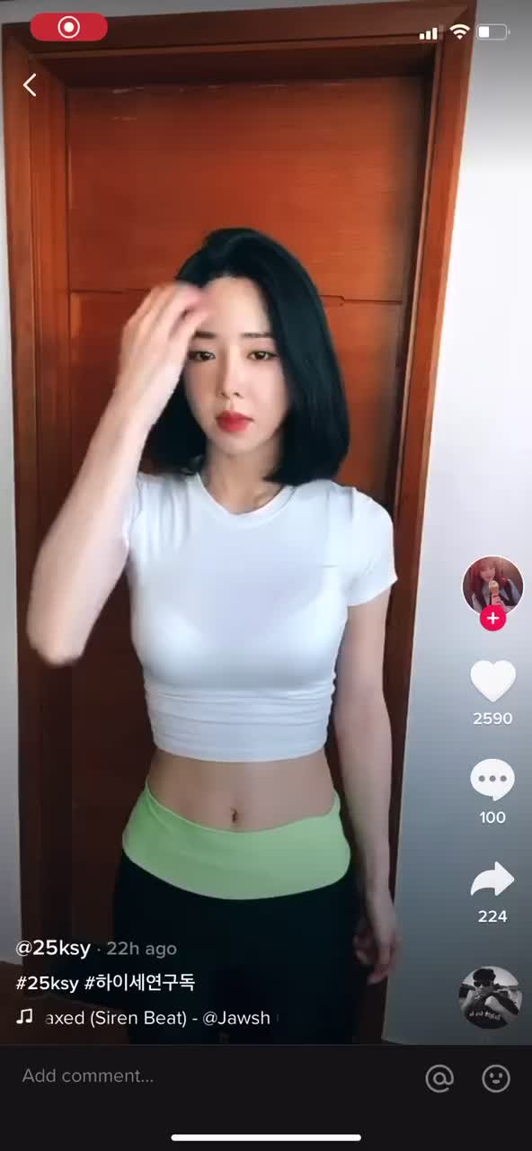 Sexy Asian girl with athletic body does erotic dance with 6 pack