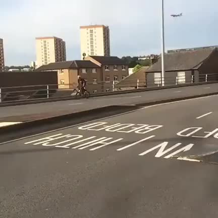 This biker riding straight down a wall